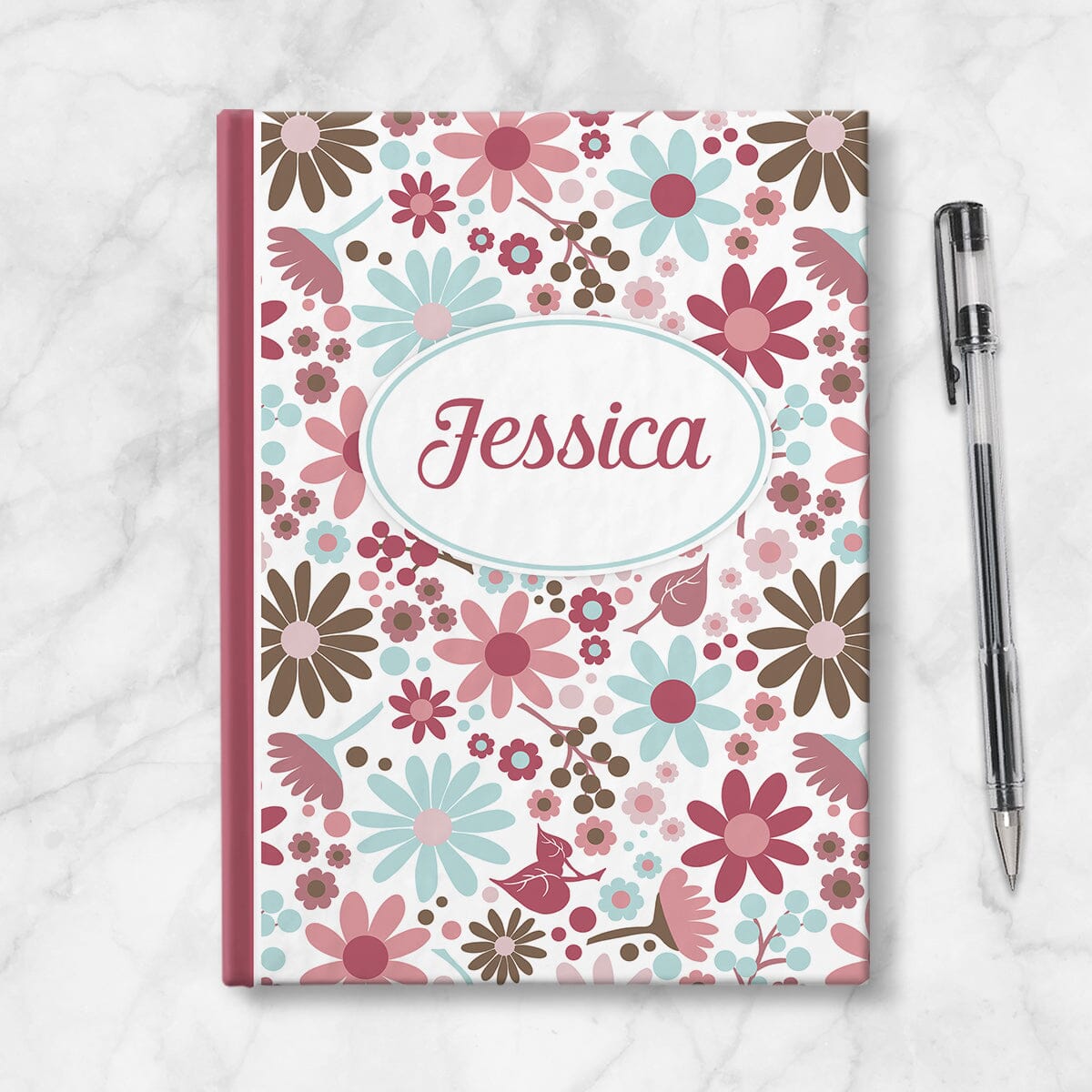 Personalized Berry Blue Summer Flowers Journal at Artistically Invited. Image of journal on table with a pen next to it.