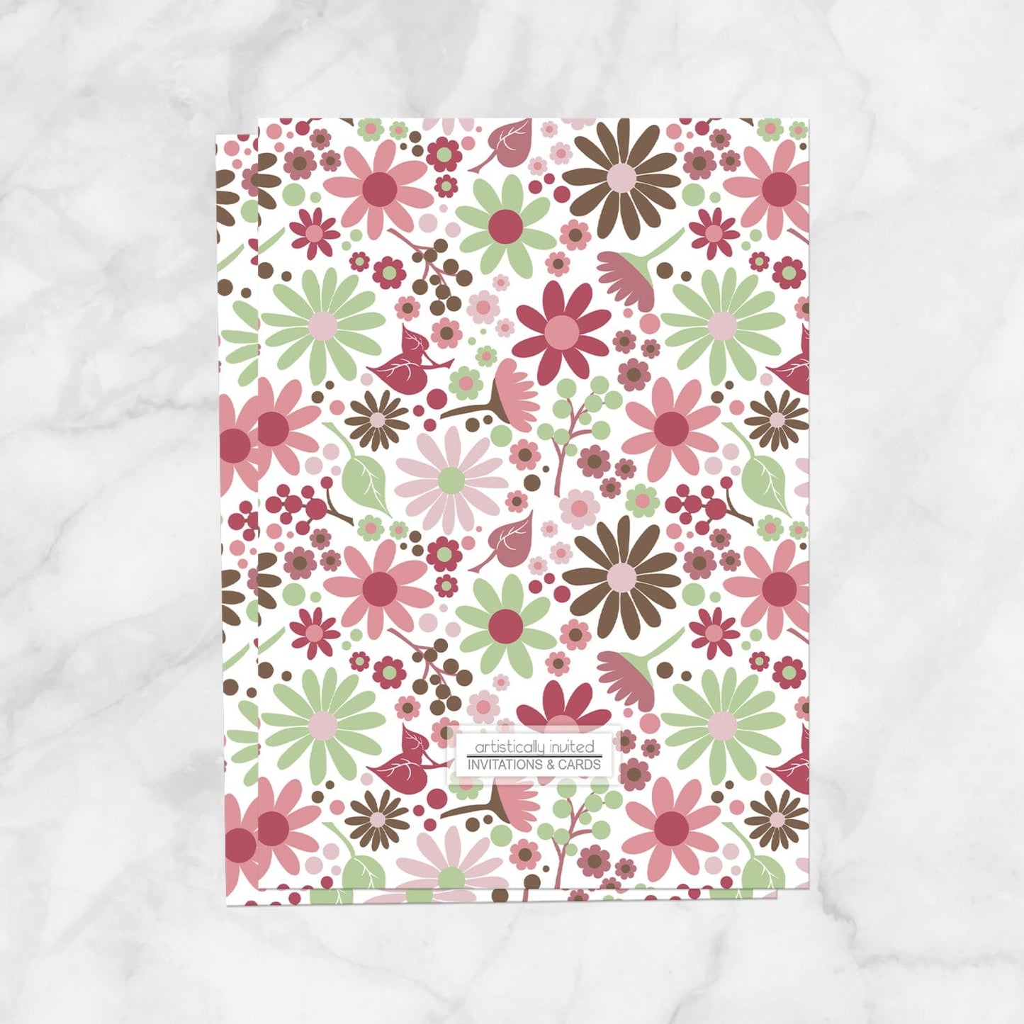The backside of the floral bridal shower invitation with green, pink, and brown flowers, which is a printed feature when you purchase the printed invitation upgrade.