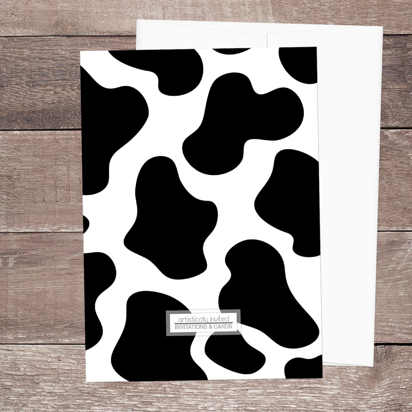 The backside of the cow print invitations when the printed invitation upgrade is purchased.