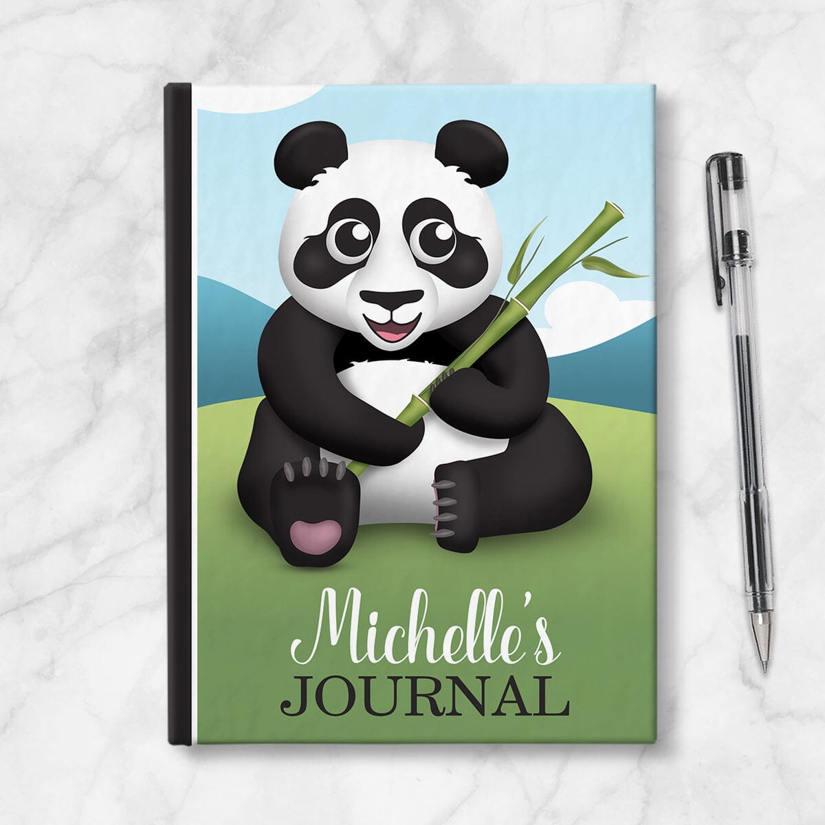 Personalized Cute Panda with Bamboo Journal at Artistically Invited. Image shows book on countertop with a pen next to it.