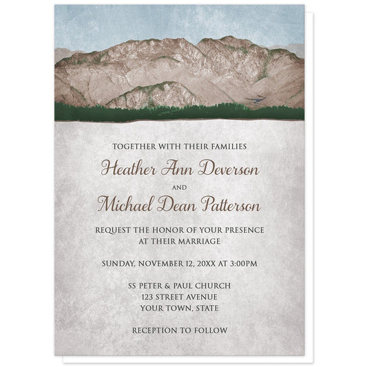 Rustic Mountain Scene Wedding Invitations at Artistically Invited. Mid-West country-inspired rustic mountain scene wedding invitations with a rough mountain landscape illustration over a faded vintage light blue sky along the top. Your personalized marriage celebration details are arranged over a rustic light parchment illustration.