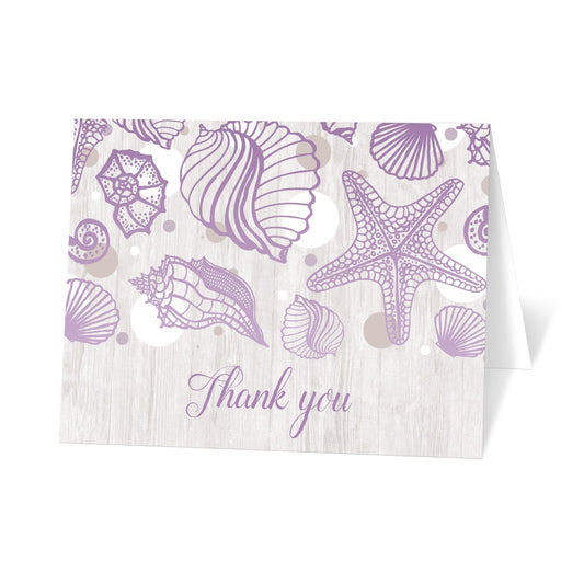 Seashell Whitewashed Wood Purple Beach Thank You Cards at Artistically Invited. Seashell whitewashed wood purple beach thank you cards with a purple seashell outline drawing, tan and white dots, over a light whitewashed wood background illustration. The seashell line drawing over the varying sized circles are the modern element in this design, while the unique whitewashed wood adds the rustic touch. "Thank you" is printed in a purple script font below the seashells over the whitewashed wood.