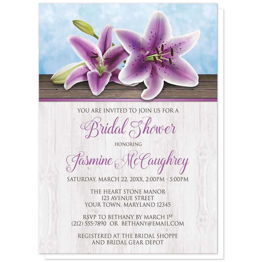 Pretty Floral Wood Purple Lily Bridal Shower Invitation at Artistically Invited. Southern country-inspired pretty floral wood purple lily bridal shower invitations with two purple lilies on a light wood surface over a blue background design. Your personalized bridal shower celebration details are arranged in purple and dark brown over the light wood pattern.