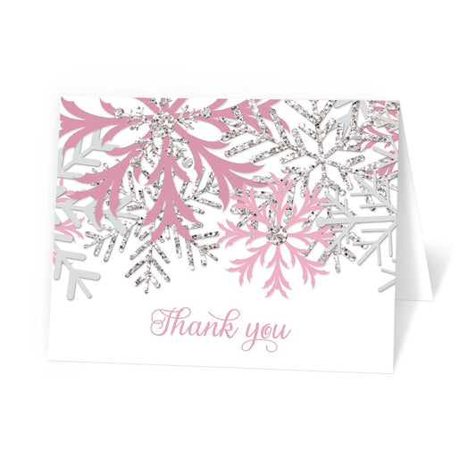 Winter Pink Silver Snowflake Thank You Cards at Artistically Invited. Winter pink silver snowflake thank you cards with pink and silver-colored glitter-illustrated snowflakes over a white background and 'Thank you' printed in a whimsical pink script font. 