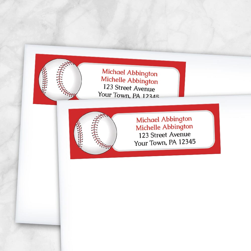 Red Baseball Return Address Labels (shown on envelopes) at Artistically Invited. Red baseball return address labels personalized with your address. They're illustrated with a white baseball on the left side over a red background. Your personalized return address is custom printed in red and black in a white rectangular area next to the baseball.