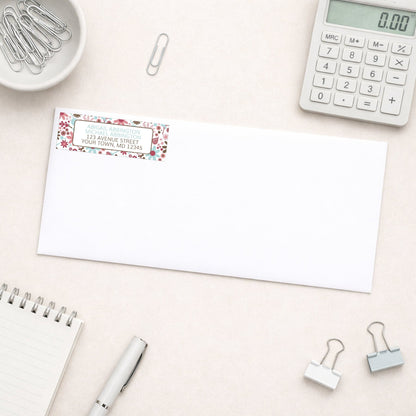 Berry Blue Summer Flowers Address Label shown on a white envelope with office supplies