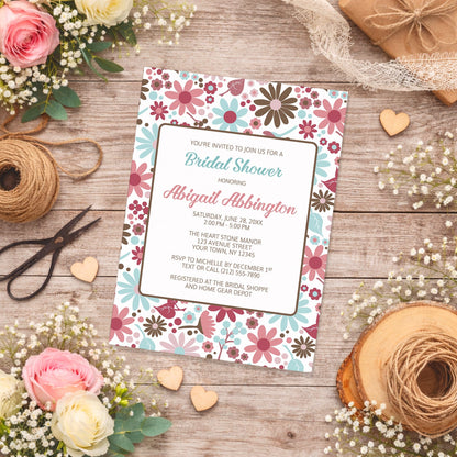 Berry Blue Summer Flowers Bridal Shower Invitation on a wooden surface with flowers and twine.