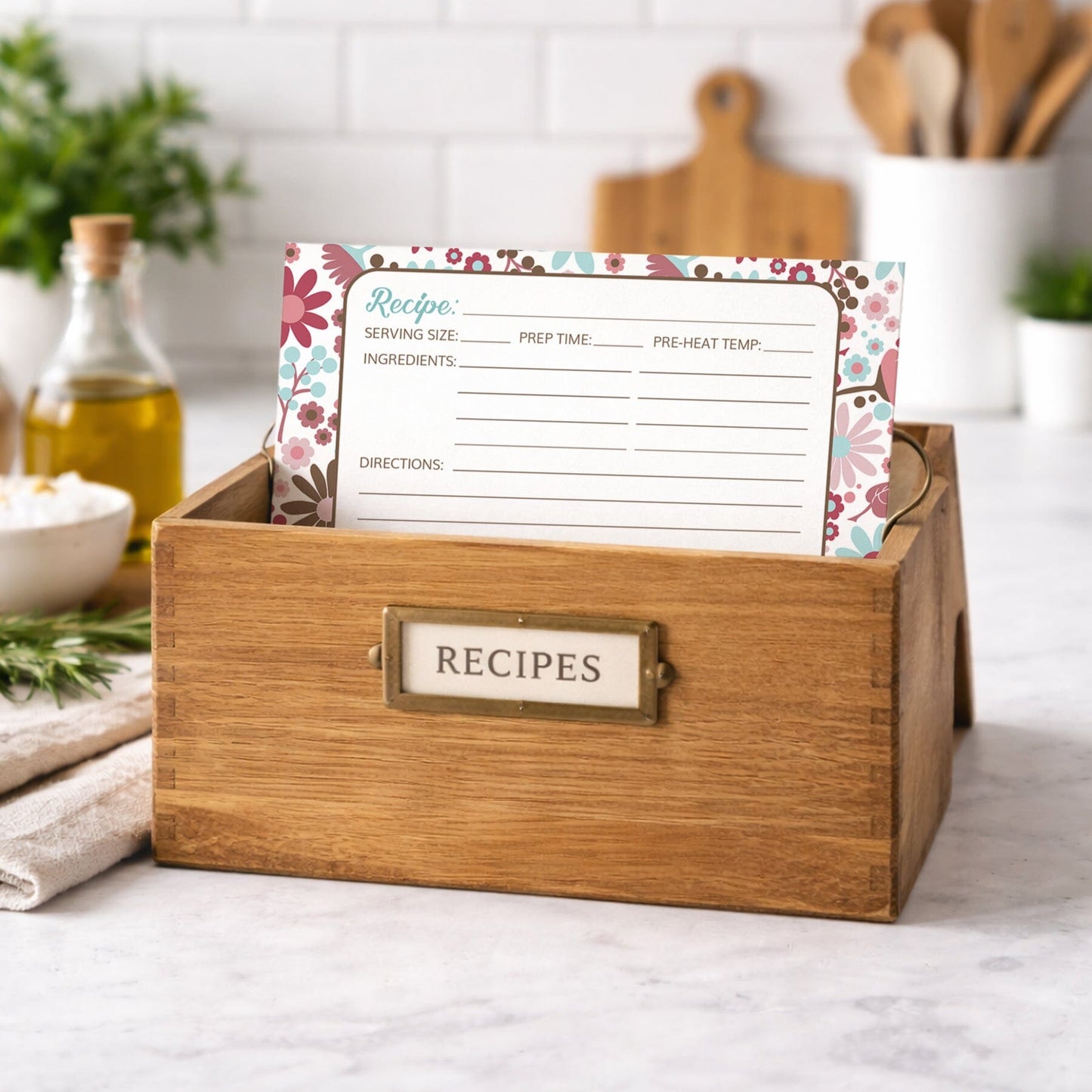 Wooden recipe box with the Berry Blue Summer Flowers Recipe Card on a kitchen counter.
