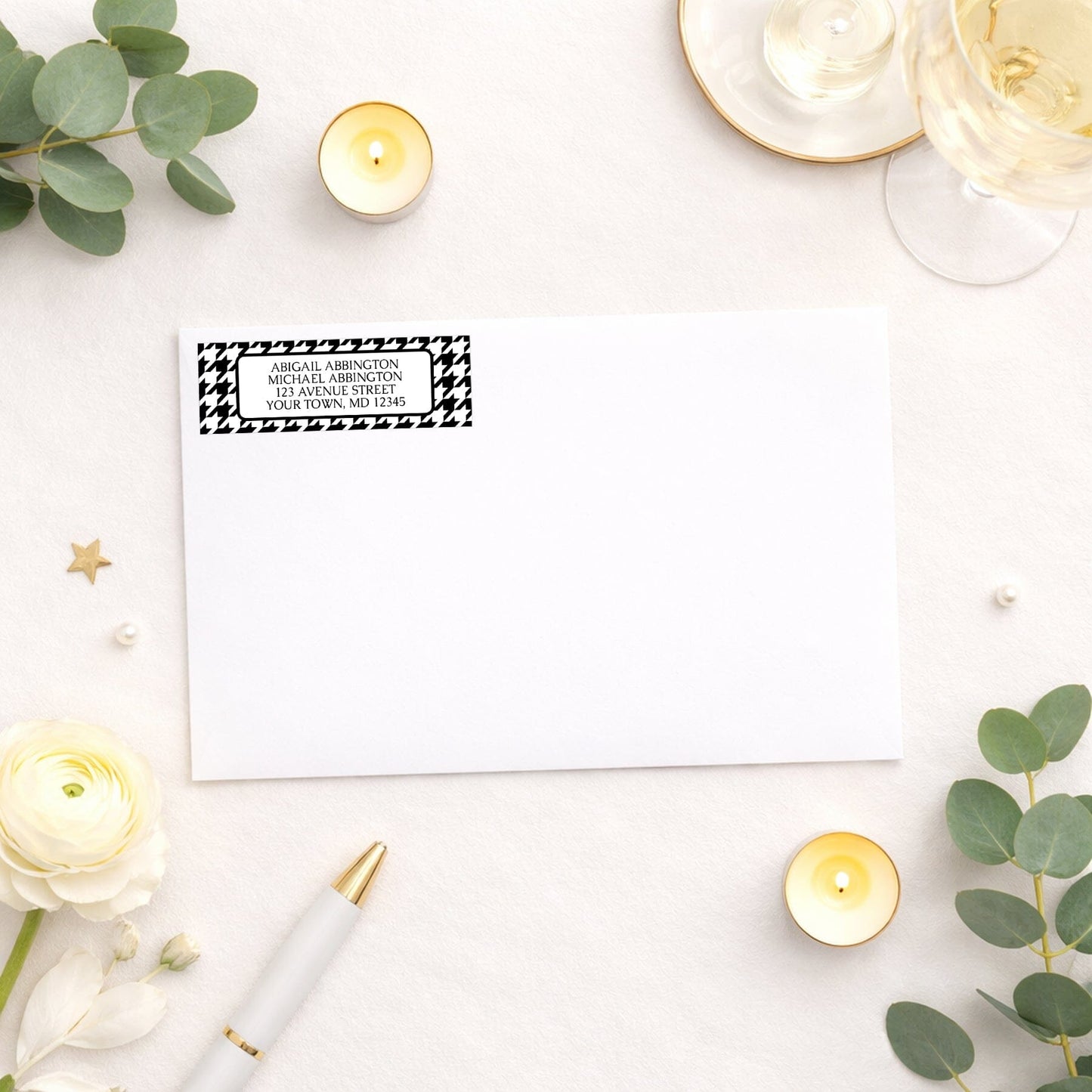 Black and White Houndstooth Address Label shown on a white envelope with wedding and shower supplies.