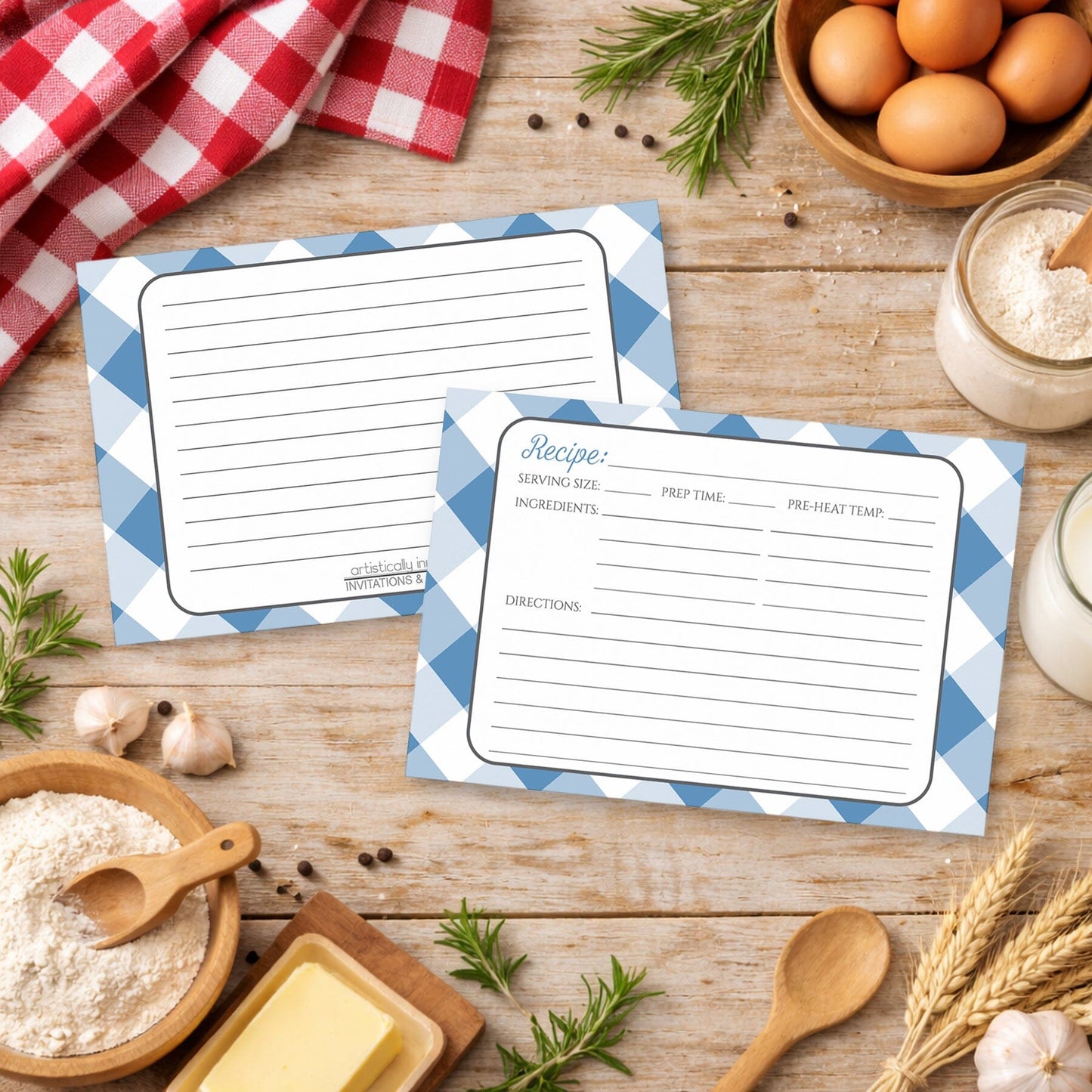 Two Blue Gingham Recipe Cards on a wooden surface with with country kitchen items around