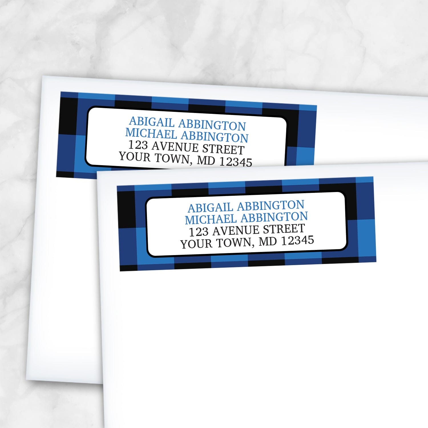 2 Blue and Black Buffalo Plaid Address Labels shown on white envelopes on a marble surface
