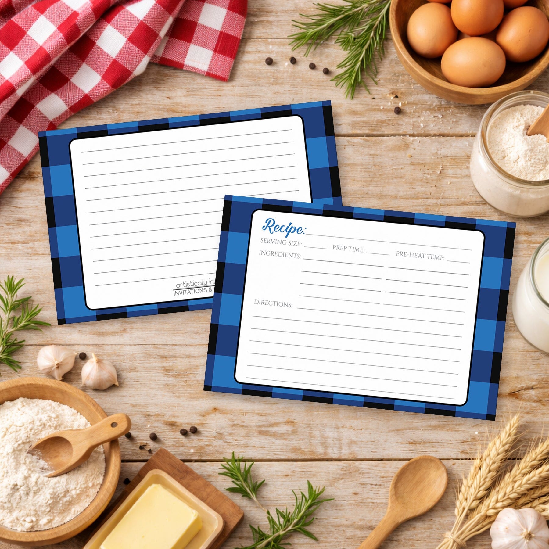 Two Blue and Black Buffalo Plaid Recipe Cards with blue checkered borders on a country wooden surface with cooking ingredients.