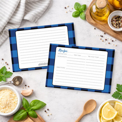 Two Blue and Black Buffalo Plaid Recipe Cards with blue checkered borders on a kitchen counter with ingredients.