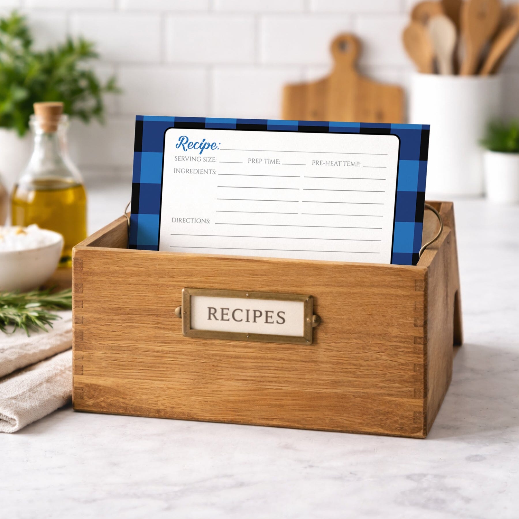 Wooden recipe box with a Blue and Black Buffalo Plaid Recipe Card inside, set against a kitchen background.
