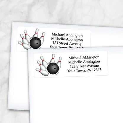 2 Bowling Ball and Pins Address Labels shown on white envelopes on a marble surface