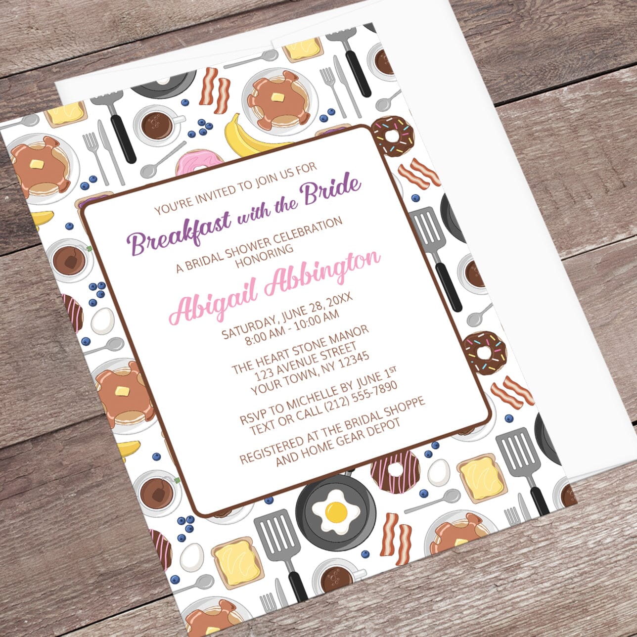 Invitation for 'Breakfast with the Bride' bridal shower, shown on a wooden surface