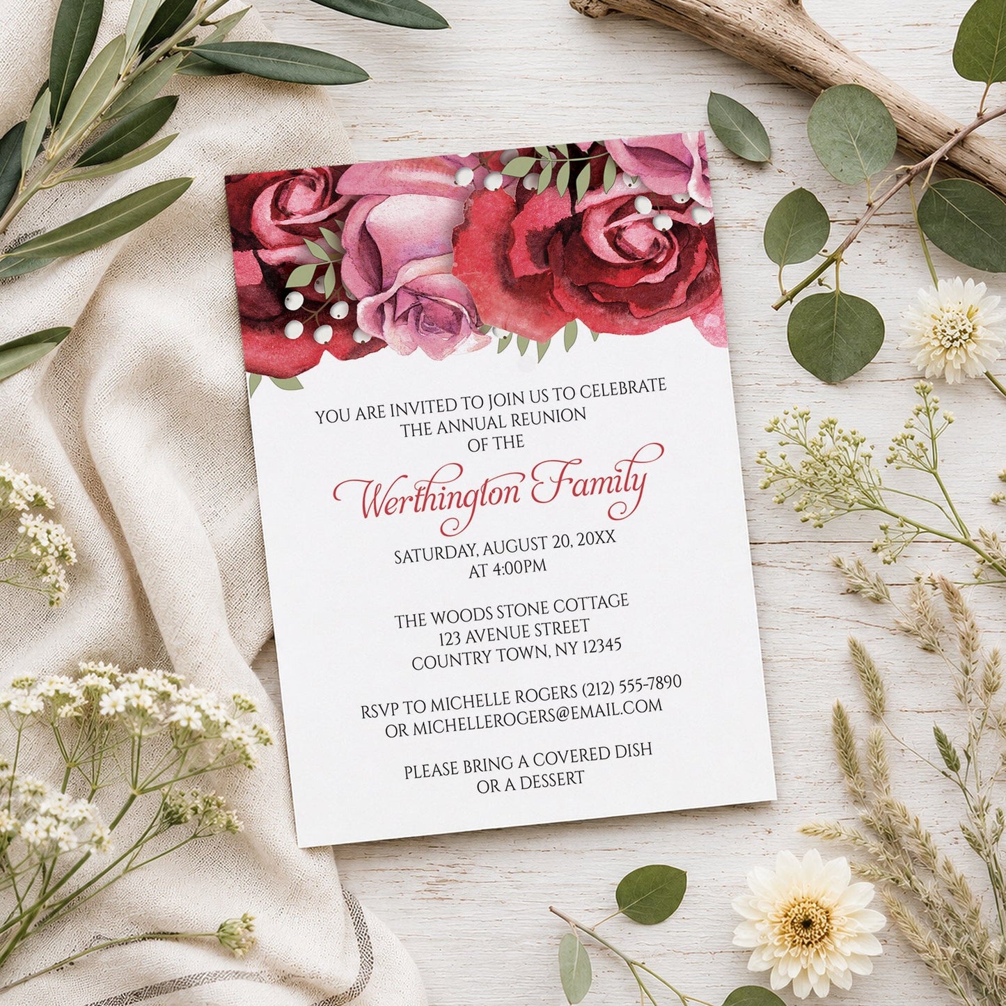 Burgundy Red Pink Rose Family Reunion Invitation shown on a wooden surface with spring and summer plants.