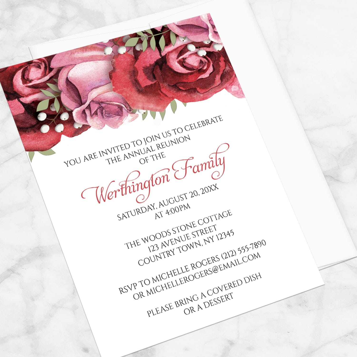 Burgundy Red Pink Rose Family Reunion Invitation shown at an angle on a marble surface with a white envelope.