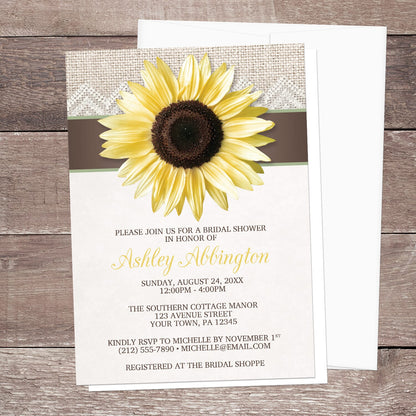 Rustic bridal shower invitation with a large yellow sunflower, burlap and lace, with brown and beige, displayed with a white envelope on a wood surface