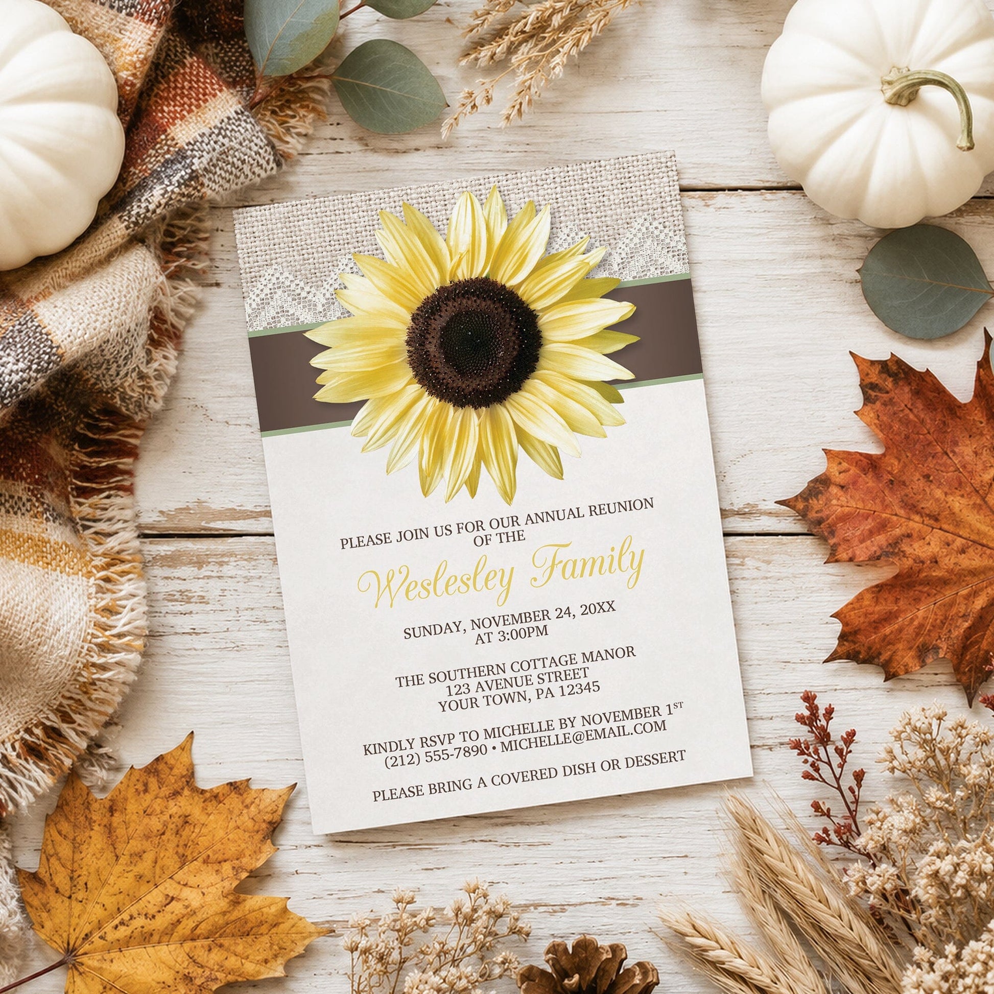Burlap Lace Brown Sage Sunflower Family Reunion Invitation shown on a light wood surface with fall leaves and autumn decor.