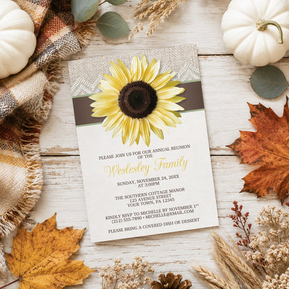 Burlap Lace Brown Sage Sunflower Family Reunion Invitation shown on a light wood surface with fall leaves and autumn decor.
