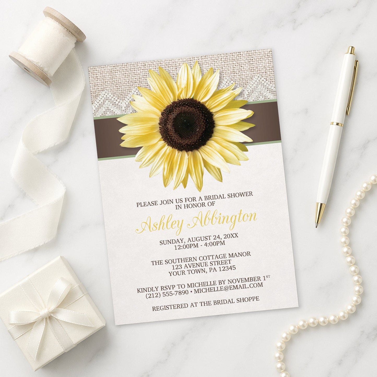 Burlap Lace Brown Sunflower Bridal Shower Invitation on a marble surface with decorative items.