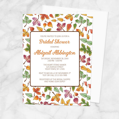 Bridal shower invitation with autumn leaf design on a white background