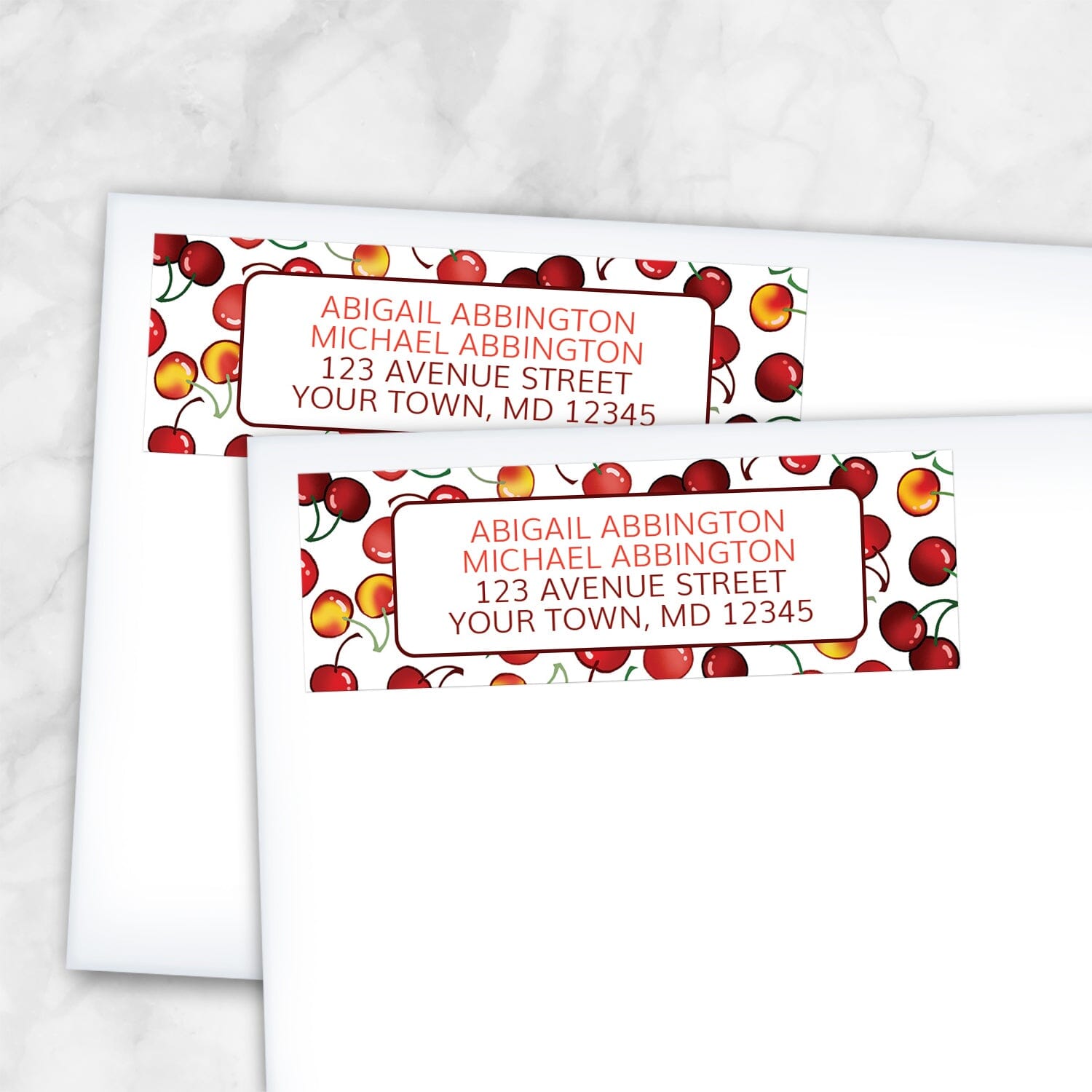 2 Cherries Address Labels shown on white envelopes on a marble surface