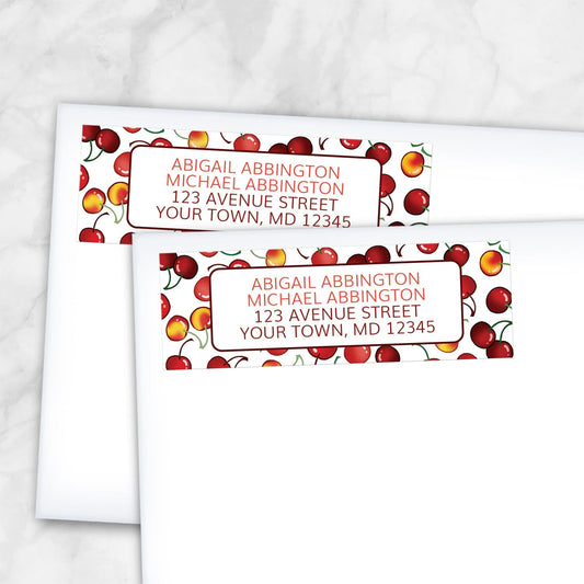 2 Cherries Address Labels shown on white envelopes on a marble surface