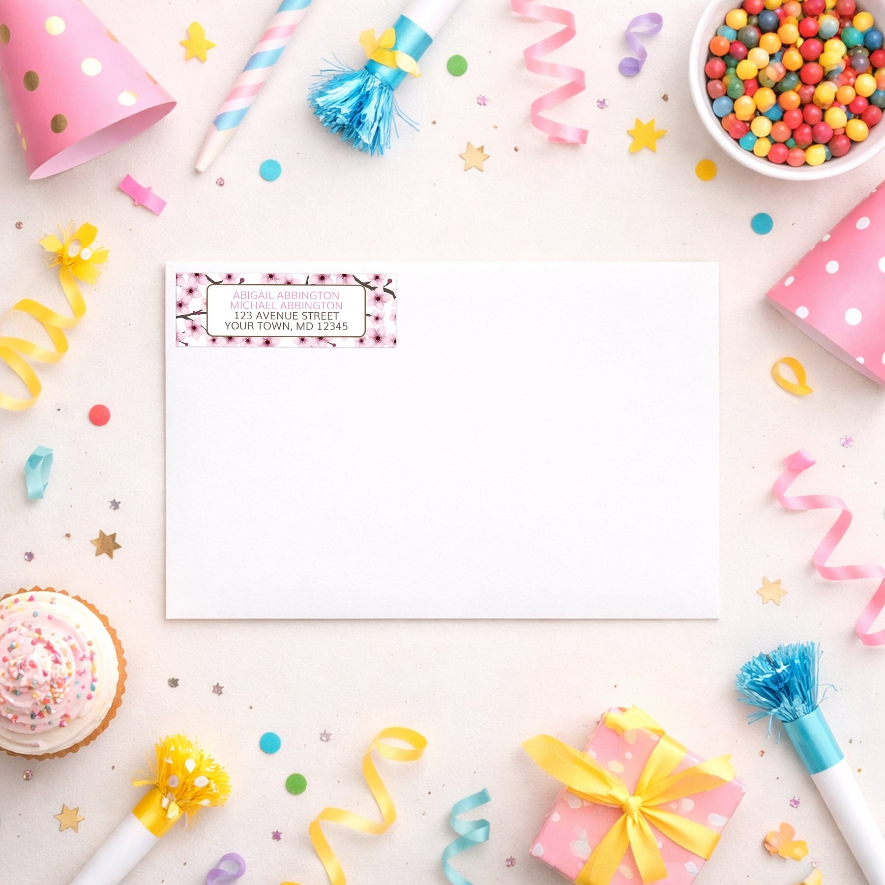 Cherry Blossom Address Label shown on a white envelope with party supplies