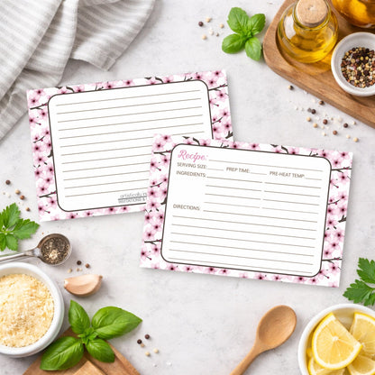 Two Cherry Blossom Recipe Cards on a kitchen counter with ingredients.