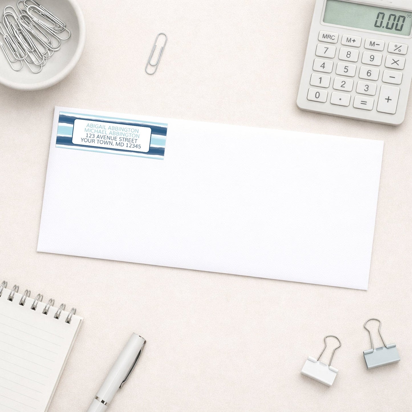 Coastal Paint Brush Strokes Address Label shown on white envelope on a desk with office supplies.