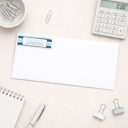Coastal Paint Brush Strokes Address Label shown on white envelope on a desk with office supplies.