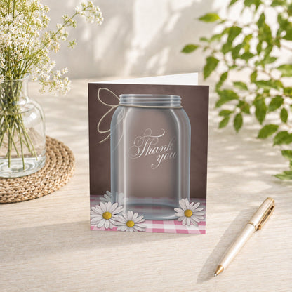 Country Mason Jar Daisy Gingham Thank You Card on a tabletop with a vase, spring and summer flowers, and a pen.