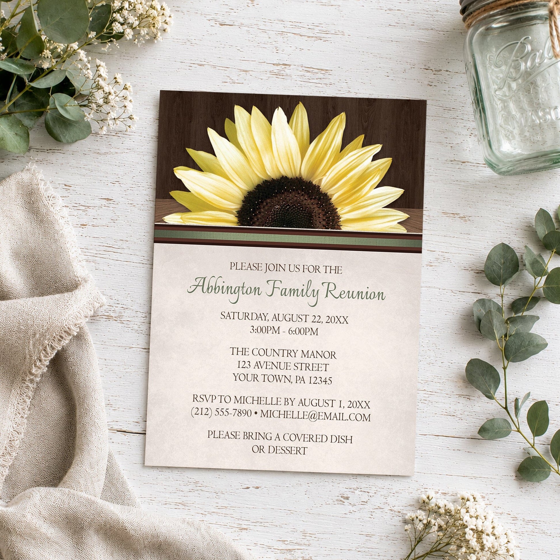 Country Sunflower Over Wood Rustic Family Reunion Invitation shown on a wooden surface with plants and a small mason jar.