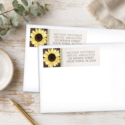 Country Sunflower Wood Brown Green Address Labels on white envelopes shown on a wood surface with plants and a pen.