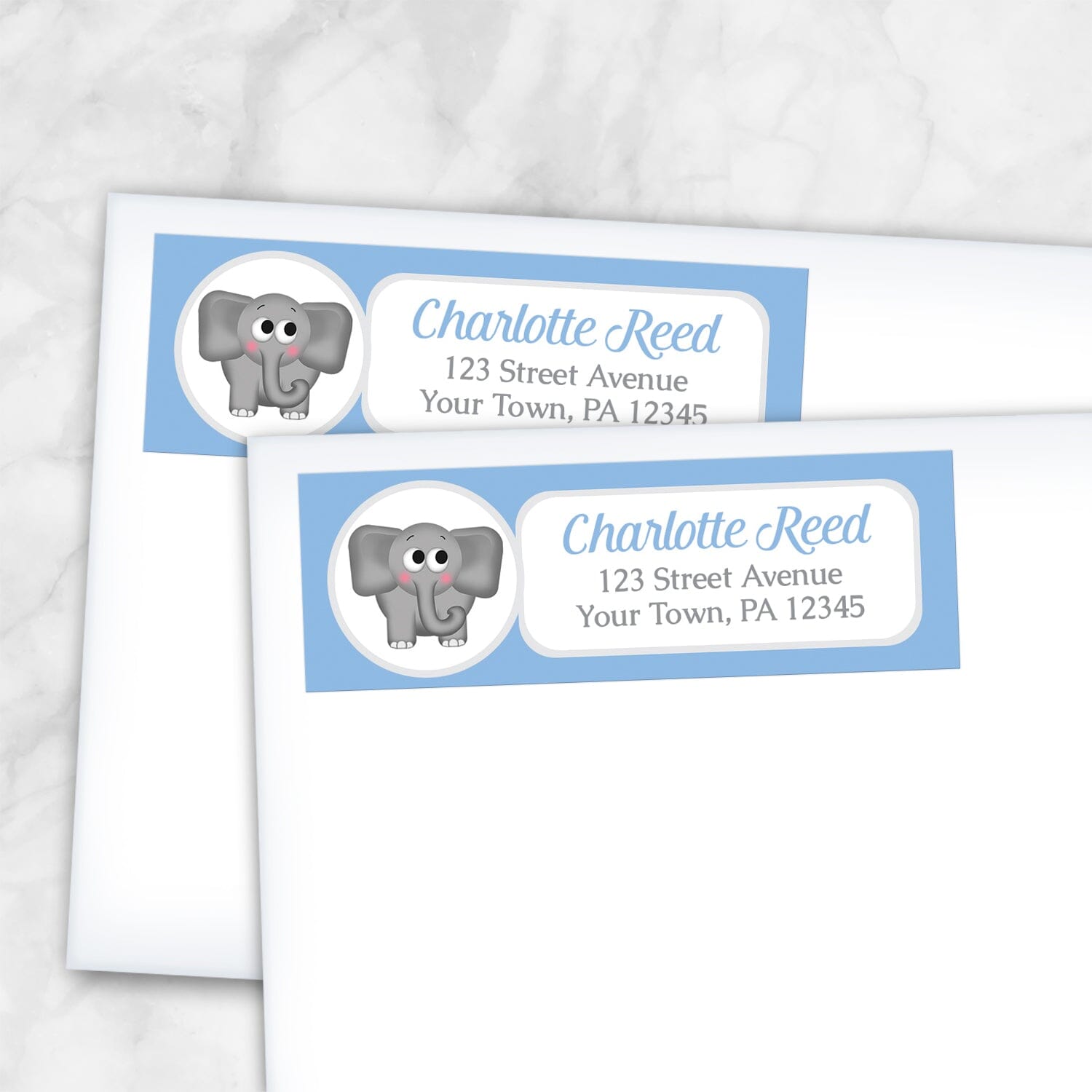 2 Cute Elephant Blue Address Labels shown on white envelopes on a marble surface