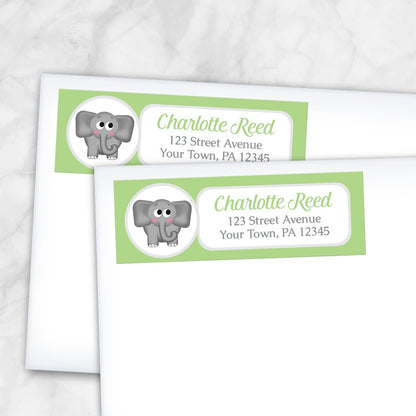 2 Cute Elephant Green Address Labels shown on white envelopes on a marble surface