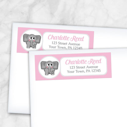2 Cute Elephant Pink Address Labels shown on white envelopes on a marble surface