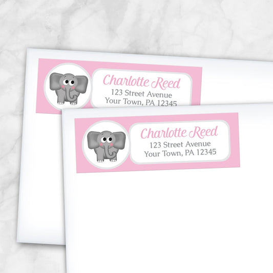2 Cute Elephant Pink Address Labels shown on white envelopes on a marble surface