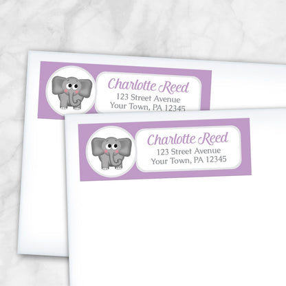 2 Cute Elephant Purple Address Labels shown on white envelopes on a marble surface
