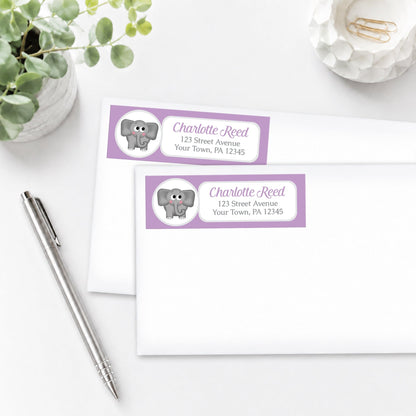 Cute Elephant Purple Address Labels, shown on white envelopes, on a white surface with a pen and a plant.