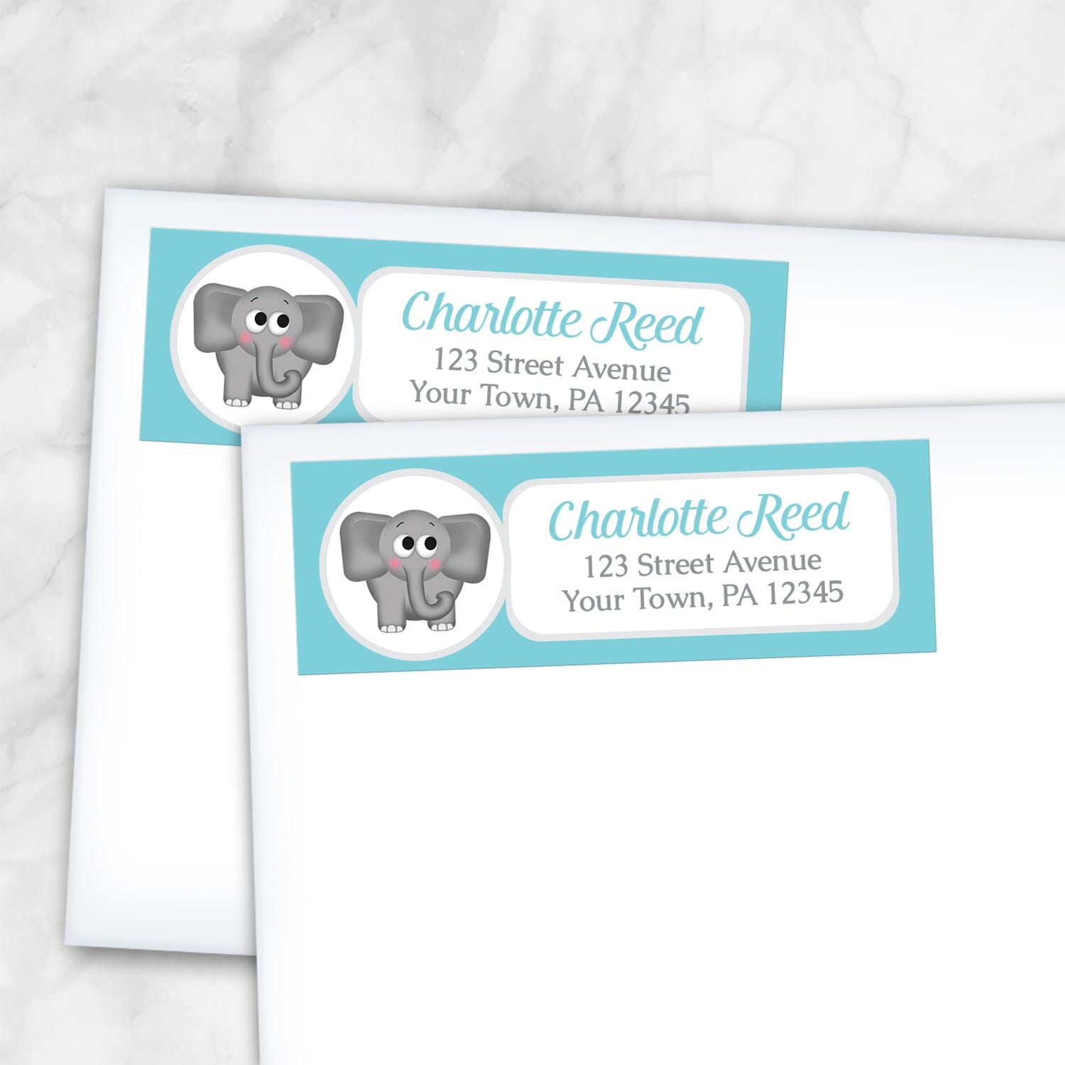 2 Cute Elephant Turquoise Address Labels shown on white envelopes on a marble surface