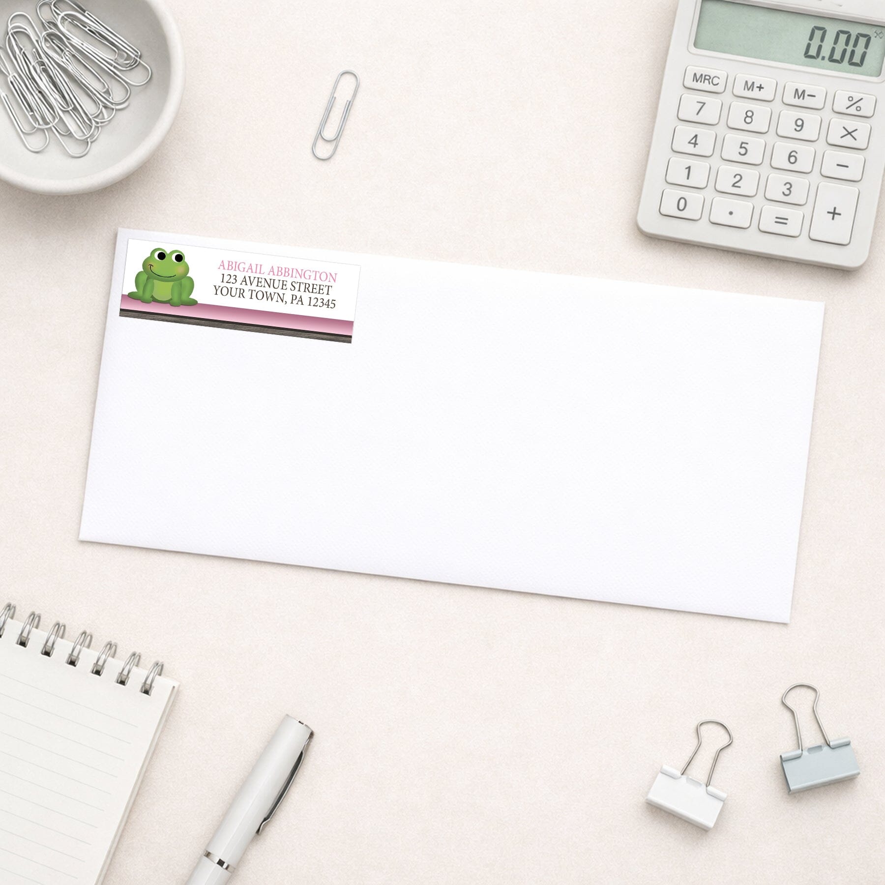 Cute Frog Green Pink Rustic Brown Address Label shown on a white envelope with everyday office supplies