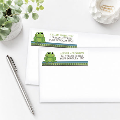 Cute Frog Green Rustic Brown Address Labels, shown on white envelopes, on a white surface with a plant and a pen.