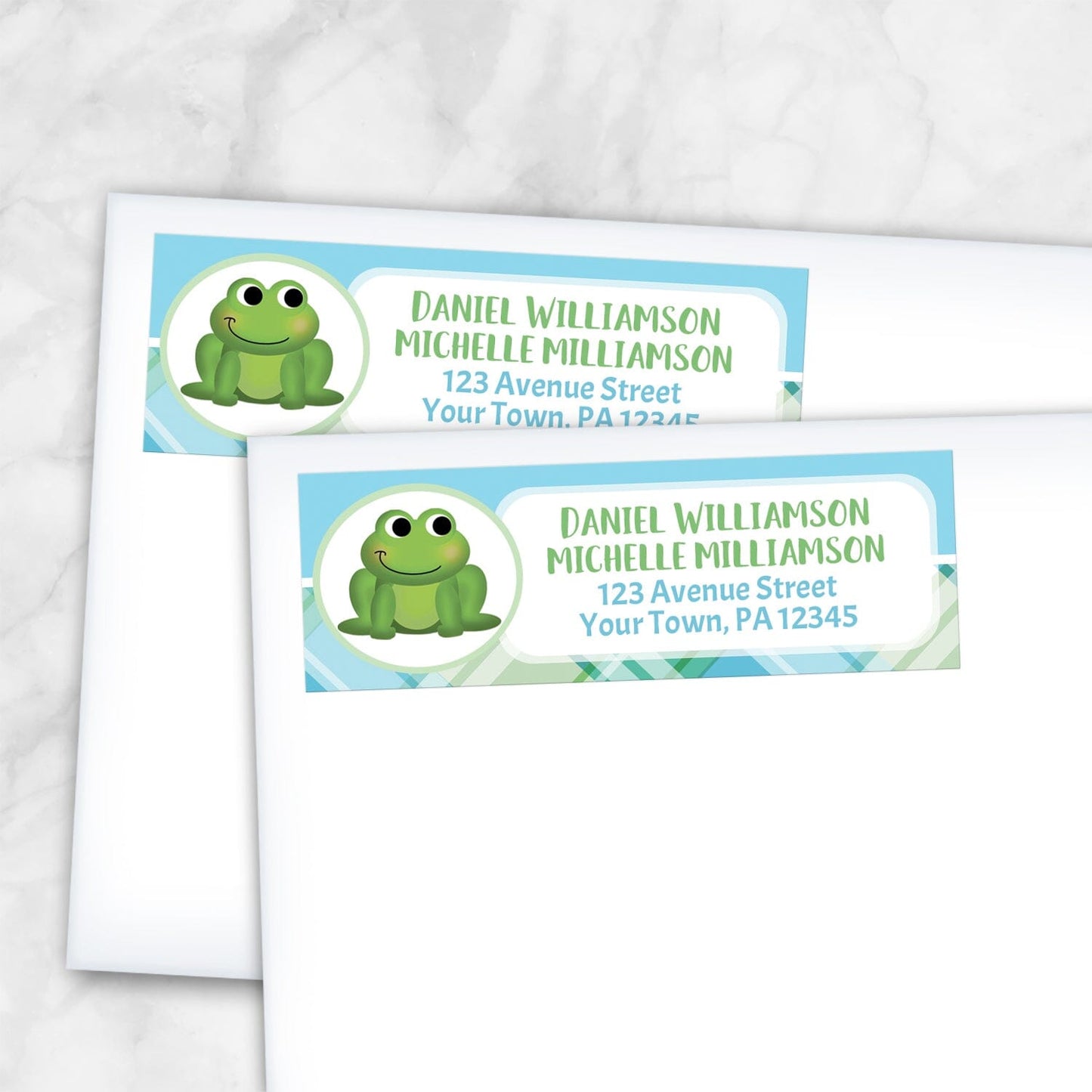 2 Cute Frog Green and Blue Plaid Address Labels shown on white envelopes on a marble surface