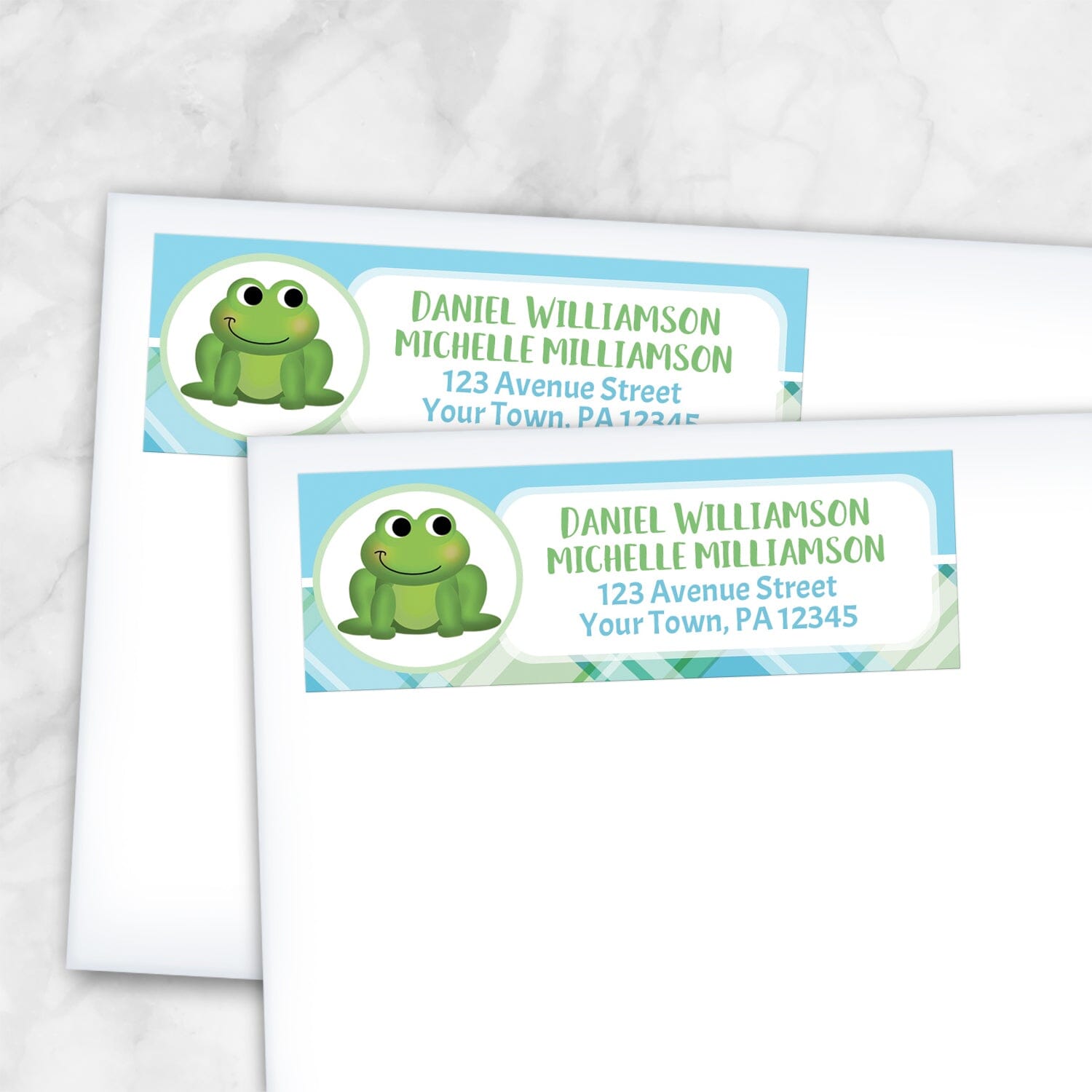 2 Cute Frog Green and Blue Plaid Address Labels shown on white envelopes on a marble surface
