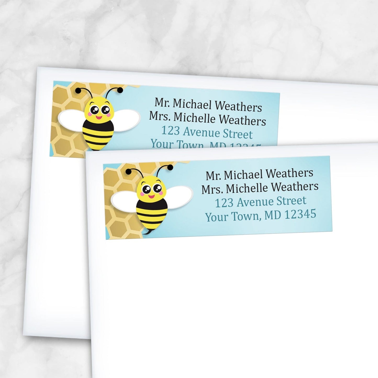 2 Cute Honeycomb Bee Address Labels shown on white envelopes on a marble surface