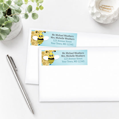 Cute Honeycomb Bee Address Labels shown on envelopes with a pen and plant in the beside them.