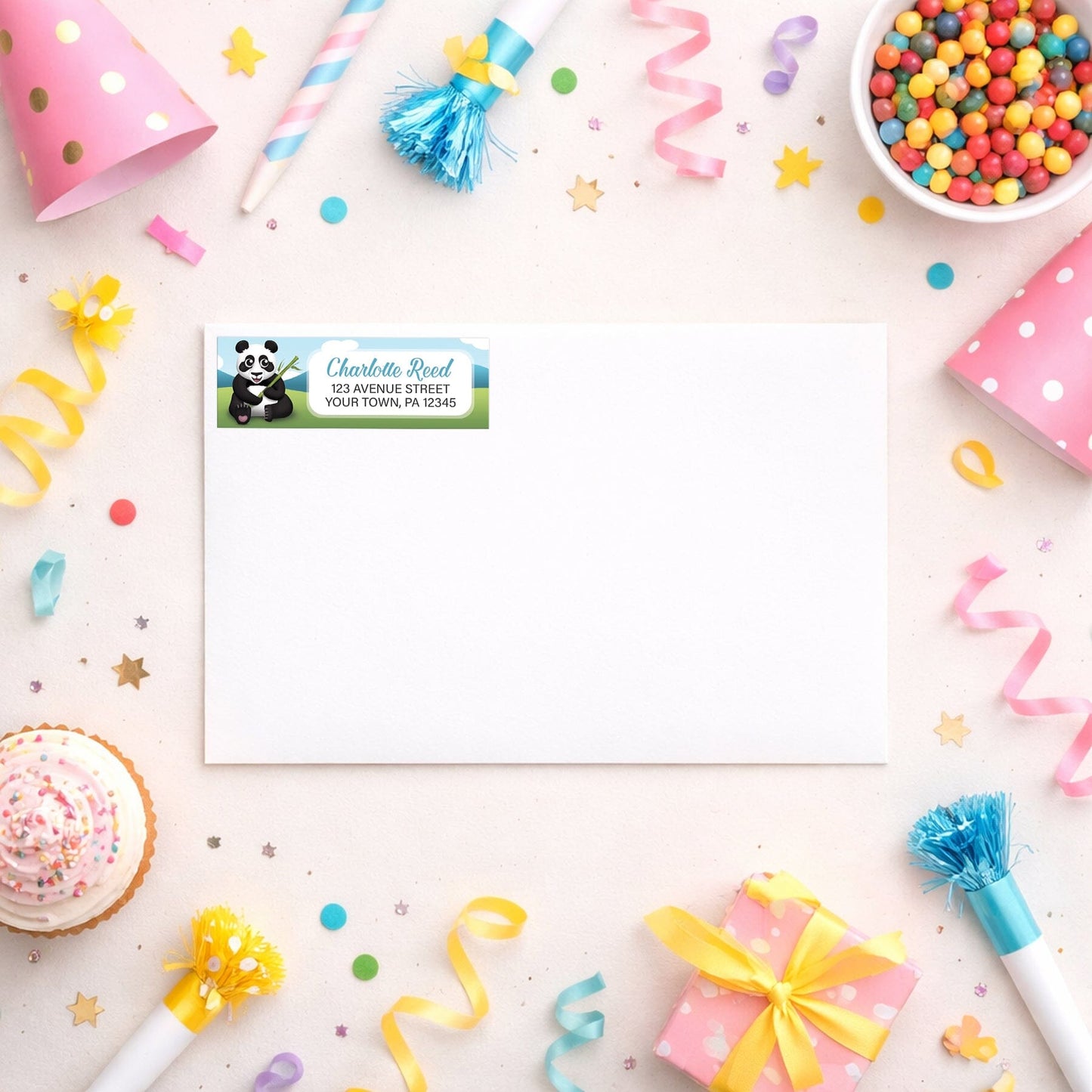 Cute Panda with Bamboo Address Label shown on a white envelope with party supplies